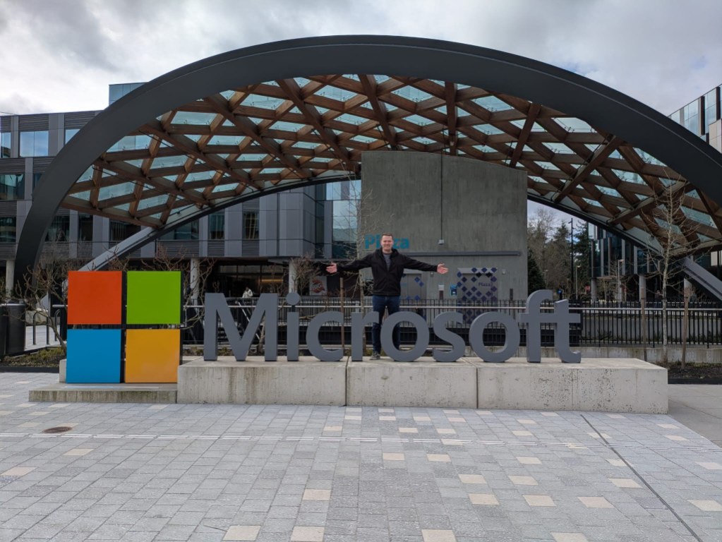 Anthony Sheldrake standing behind the Microsoft sign